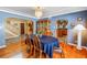 Classic dining room with hardwood floors and archway to other rooms in the house at 1449 45Th Ne Ave, St Petersburg, FL 33703