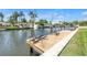 A private boat dock with a boat lift offers waterfront canal access, perfect for boating and water activities at 1449 45Th Ne Ave, St Petersburg, FL 33703