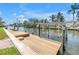 A private boat dock with a boat lift offers waterfront canal access, perfect for boating and water activities at 1449 45Th Ne Ave, St Petersburg, FL 33703