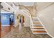 Elegant foyer showcasing high ceilings, staircase, tile flooring, and arched entryways at 1449 45Th Ne Ave, St Petersburg, FL 33703