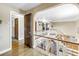 Spacious upstairs hallway with wood floors and an ornamental railing overlooking the staircase at 1449 45Th Ne Ave, St Petersburg, FL 33703