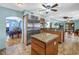 Large kitchen features stainless steel appliances, a center island, and adjacent breakfast nook and dining room at 1449 45Th Ne Ave, St Petersburg, FL 33703