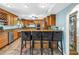 Spacious kitchen with custom cabinets, stainless appliances, granite countertops, and breakfast bar seating at 1449 45Th Ne Ave, St Petersburg, FL 33703