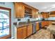 Bright kitchen featuring updated appliances, ample cabinet space, granite counters, and seamless design at 1449 45Th Ne Ave, St Petersburg, FL 33703