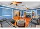 Comfortable living room with hardwood flooring, an open staircase view, and modern entertainment setup at 1449 45Th Ne Ave, St Petersburg, FL 33703