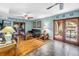 Cozy living room with hardwood flooring, glass doors, and plenty of natural light at 1449 45Th Ne Ave, St Petersburg, FL 33703