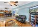 Comfortable living room area with hardwood flooring and an open view to the kitchen at 1449 45Th Ne Ave, St Petersburg, FL 33703