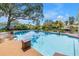 Backyard pool features a beautiful view of the canal, complemented by mature landscaping and inviting patio area at 1449 45Th Ne Ave, St Petersburg, FL 33703
