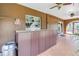 Enclosed lanai featuring a built-in wet bar, tile flooring, and multiple ceiling fans at 1449 45Th Ne Ave, St Petersburg, FL 33703