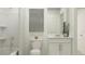 Bright bathroom featuring a shower-tub combo, sleek vanity and modern fixtures at 14970 Topaz Blue St, Wimauma, FL 33598