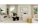 Bright living room featuring a sectional sofa, black coffee table, and modern decor at 14970 Topaz Blue St, Wimauma, FL 33598