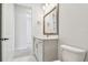 A clean bathroom with modern fixtures and a framed mirror at 1599 Running Tide Pl, Sarasota, FL 34240