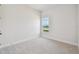 Bright bedroom with a window view of the lake at 1599 Running Tide Pl, Sarasota, FL 34240