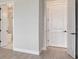 Bright hallway, bathroom doorway, and door visible at 1599 Running Tide Pl, Sarasota, FL 34240