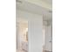 Bright hallway, bathroom vanity and door visible, with additional door on opposite wall at 1599 Running Tide Pl, Sarasota, FL 34240