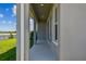 Covered outdoor lanai with view of the lake at 1599 Running Tide Pl, Sarasota, FL 34240