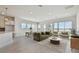 Open-concept living area with views, modern decor, and an inviting atmosphere at 1599 Running Tide Pl, Sarasota, FL 34240
