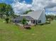 A beautiful exterior view of the home with screened in pool from the backyard at 16326 Kalli Way, Dade City, FL 33523