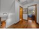 Hallway with hardwood floors leading to the bedrooms at 16326 Kalli Way, Dade City, FL 33523