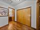 Hallway with hardwood floors leading to the bedrooms with closet access at 16326 Kalli Way, Dade City, FL 33523