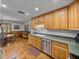 Inviting kitchen and dining area featuring stainless steel appliances and hardwood floors at 16326 Kalli Way, Dade City, FL 33523