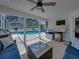 Lanai featuring an outdoor seating area and a view of the pool at 16326 Kalli Way, Dade City, FL 33523