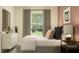 Well lit bedroom with a large window, stylish decor, a comfortable bed, and a closet offering storage at 17244 Tortoise Crown Blvd, Land O Lakes, FL 34638