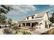 Exterior rendering of a modern farmhouse with a welcoming porch and surrounding gardens, set in a community-oriented setting at 17244 Tortoise Crown Blvd, Land O Lakes, FL 34638