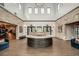 Spacious lobby area featuring stone accents, hardwood floors, and a welcoming reception desk at 17244 Tortoise Crown Blvd, Land O Lakes, FL 34638
