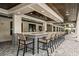 An outdoor bar showcases stylish tilework and seating in a luxurious space at 17244 Tortoise Crown Blvd, Land O Lakes, FL 34638