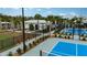 Tennis courts surrounded by lush landscaping, providing a scenic and private playing experience at 17244 Tortoise Crown Blvd, Land O Lakes, FL 34638