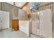 Bathroom featuring a walk-in shower, a soaking tub, and wallpapered walls at 17321 Oak Ledge Dr, Lutz, FL 33549
