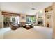 Inviting living room with a fireplace, large windows, and comfortable seating, perfect for relaxation and gatherings at 17321 Oak Ledge Dr, Lutz, FL 33549