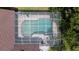 Aerial view of screened in pool with chairs and tables on the patio at 17321 Oak Ledge Dr, Lutz, FL 33549