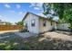 Spacious backyard featuring a wooden fence, new stairs, and mature trees at 1750 Dayton S St, St Petersburg, FL 33712