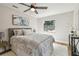 Comfortable bedroom featuring a ceiling fan, stylish bedding, and a bright window at 1750 Dayton S St, St Petersburg, FL 33712