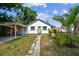 Charming single-story home with a well-manicured lawn and a covered carport at 1750 Dayton S St, St Petersburg, FL 33712