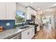 Beautiful kitchen featuring white cabinets and a subway tile backsplash at 1750 Dayton S St, St Petersburg, FL 33712