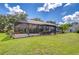 Enjoy the outdoor pool and patio with screened enclosure for bug-free relaxation at 17917 Clear Lake Dr, Lutz, FL 33548