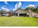 Expansive backyard features a screened-in patio perfect for outdoor entertaining at 17917 Clear Lake Dr, Lutz, FL 33548
