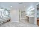 Bright bathroom with a decorative stained glass window, shower and a sink vanity at 17917 Clear Lake Dr, Lutz, FL 33548