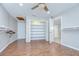 Large walk-in closet with hardwood floors, built-in shelving, and hanging storage at 17917 Clear Lake Dr, Lutz, FL 33548