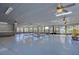Spacious community center with tables, chairs, and plenty of natural light at 17917 Clear Lake Dr, Lutz, FL 33548