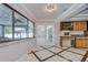 Open dining area with large windows overlooking the screened-in pool at 17917 Clear Lake Dr, Lutz, FL 33548