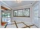 Bright dining area with view of outdoor screened-in pool at 17917 Clear Lake Dr, Lutz, FL 33548