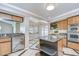 Bright kitchen features stainless appliances, granite countertops, wood cabinets, and a kitchen island at 17917 Clear Lake Dr, Lutz, FL 33548