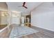 Spacious living room features hardwood floors, mirrored accent wall, and elegant lighting at 17917 Clear Lake Dr, Lutz, FL 33548