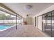 Covered patio with a pool, hot tub, and brick flooring overlooking the backyard at 17917 Clear Lake Dr, Lutz, FL 33548
