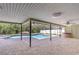 Spacious screened-in patio with a pool, hot tub, and plenty of seating area at 17917 Clear Lake Dr, Lutz, FL 33548