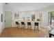 Charming bar area featuring seating, a white wood accent wall, and lots of natural light at 2200 N Glenwood Dr, Tampa, FL 33602